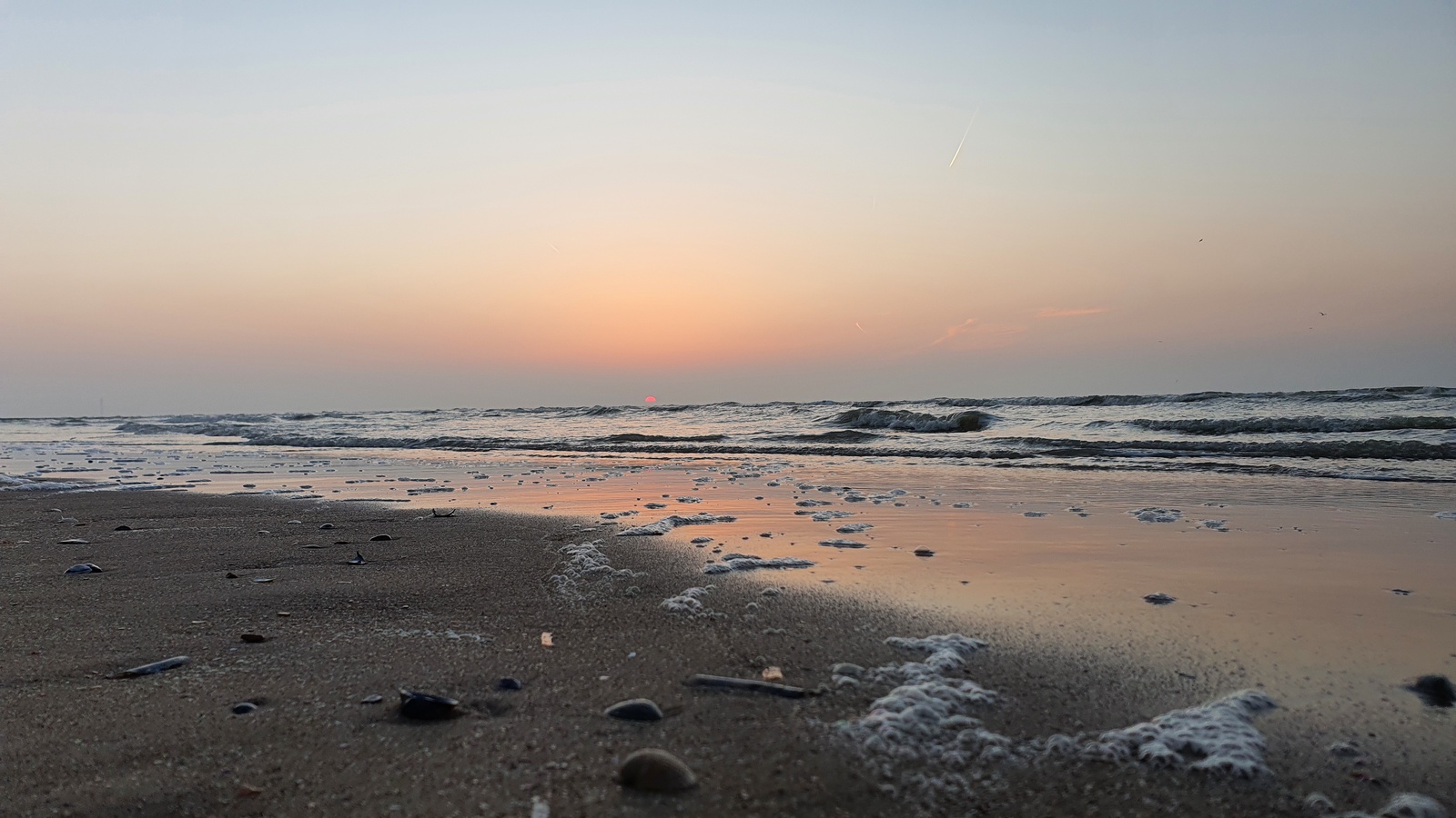 plage bredene coucher de soleil